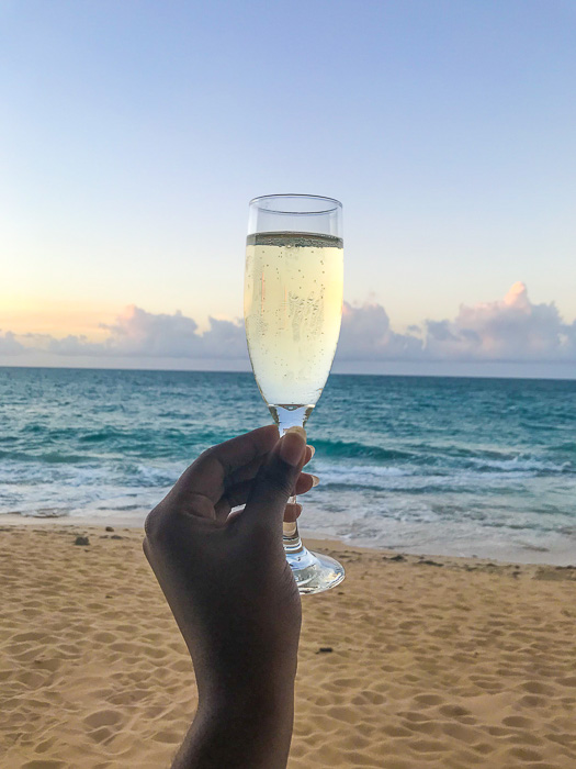champagne toast against Condado Beach backdrop