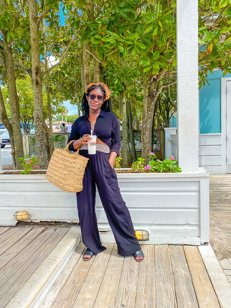 Jazzmine holding beach bag on patio in 30A, Florida