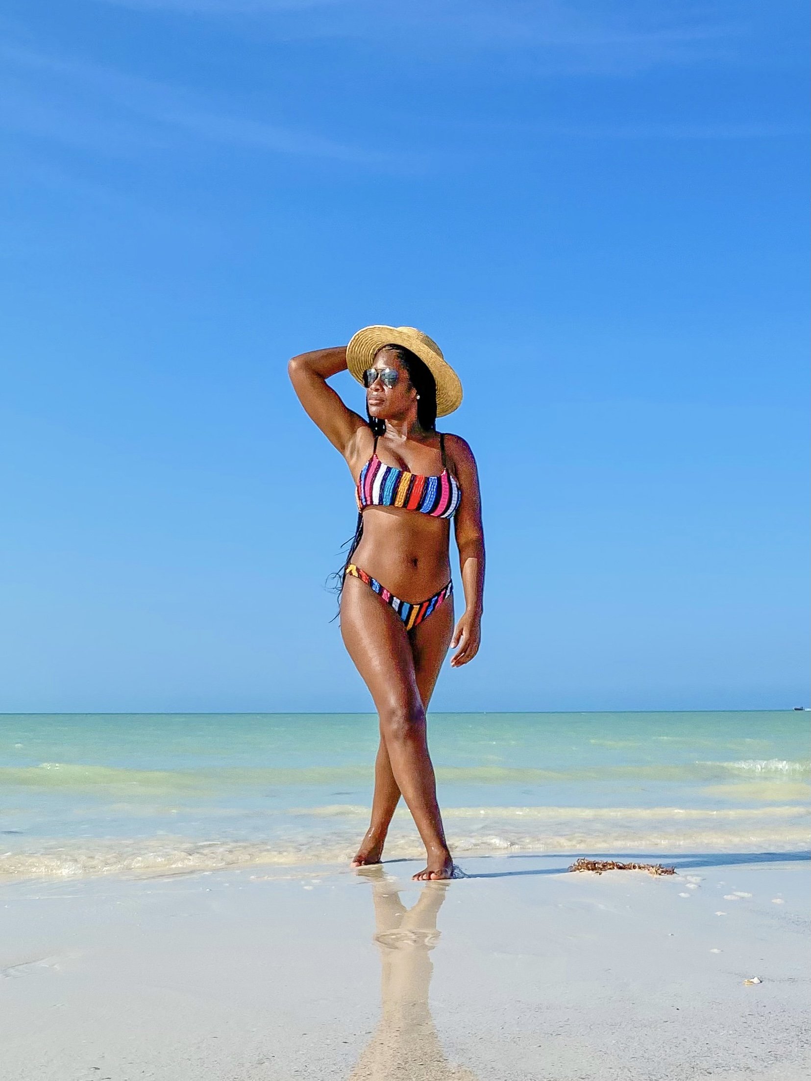 Jazzmine walking in water at Punto Mosquito in Isla Holbox, Mexico.