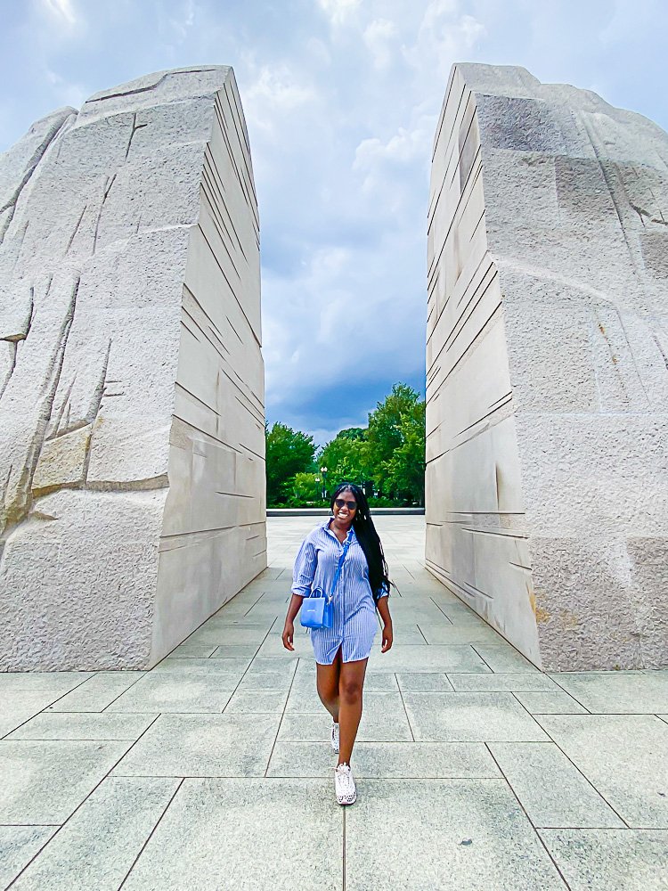 Walking between statues at MLK DC Monument.