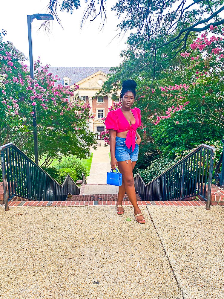 Jazzmine standing at top of outdoor brick staircase on Howard University campus.