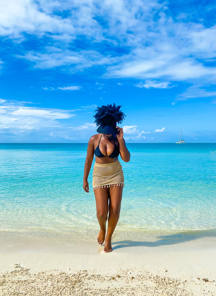 Jazzmine stepping out of water at Sapodilla Bay Beach on Providenciales.