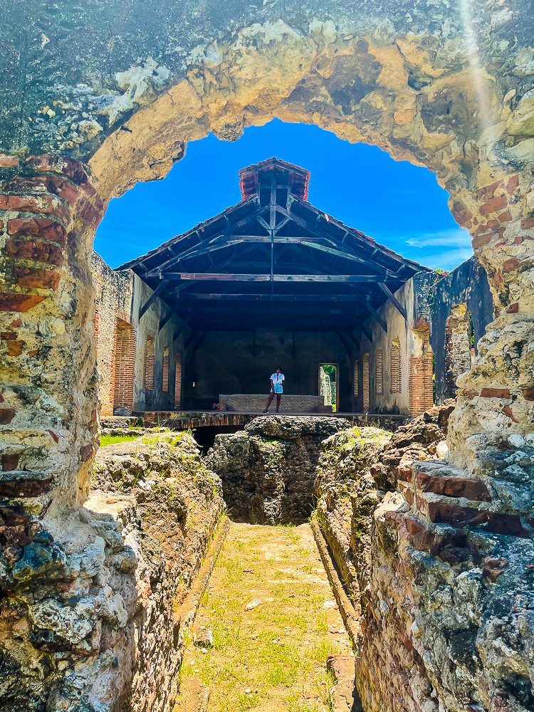 standing in abandoned sugar cane plantation in Nigua, Dominican Republic.