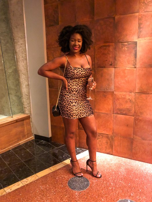 wearing leopard mini dress for night out in Vegas outfit.