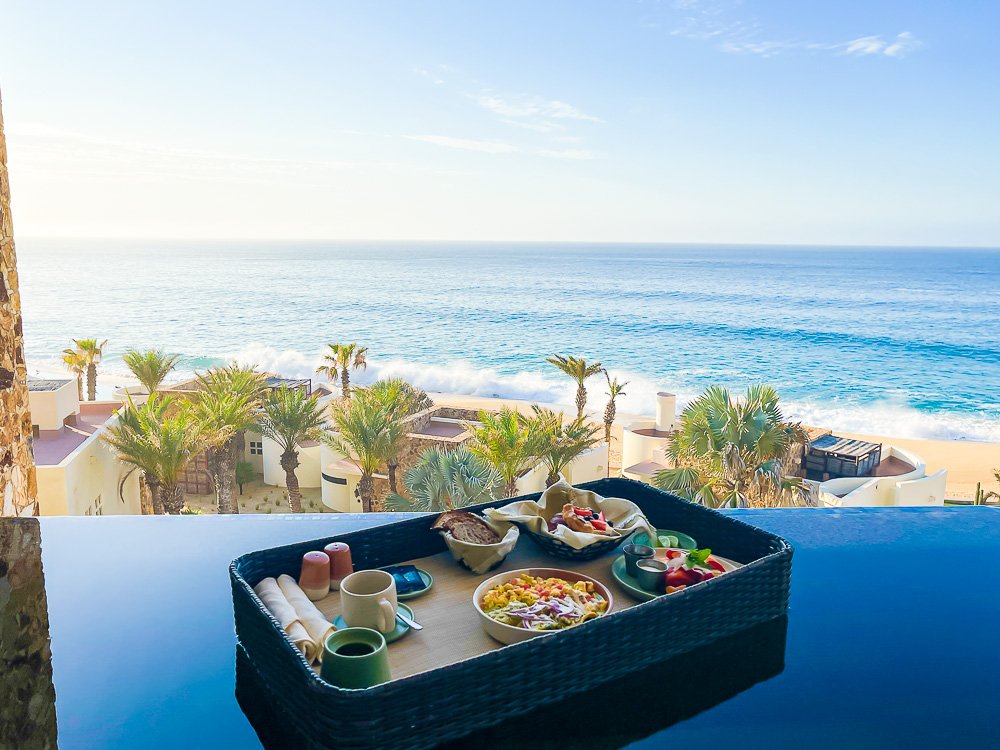 Mexican breakfast on floating tray in private infinity pool overlooking Sea of Cortez.