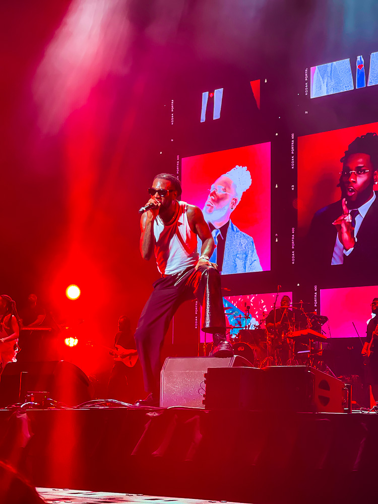 Burna Boy performing at sold out Toyota Center Houston concert on the Love, Damini Tour.