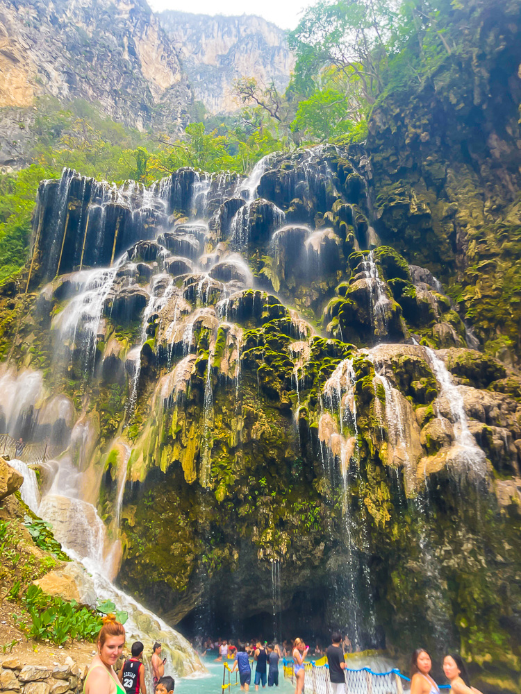 mossy waterfall dripping over entrance to Las Grutas Tolantongo cave and tunnels.