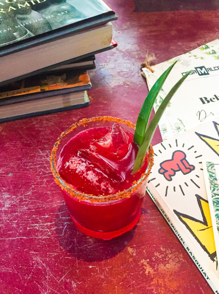 bright red cocktail on the rocks at Philosophy at Casa Malca in Tulum Hotel Zone.