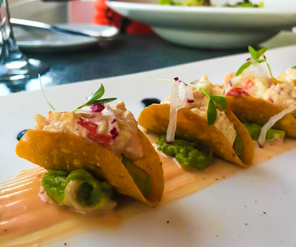 mini lobster tacos on table at aMare Mediterranean restaurant inside Serafina Beach Hotel in San Juan.