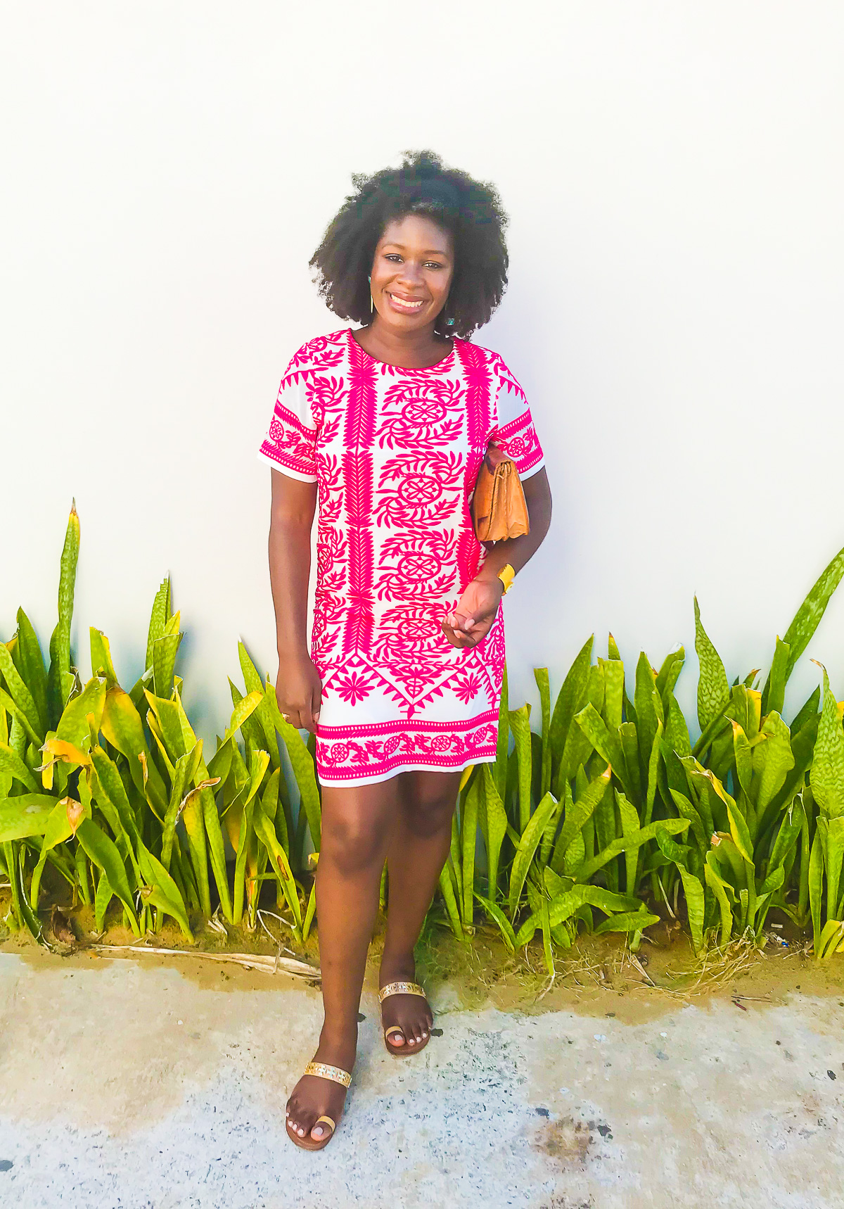 woman wearing pink and white embroidered shift dress to brunch in Condado San Juan.