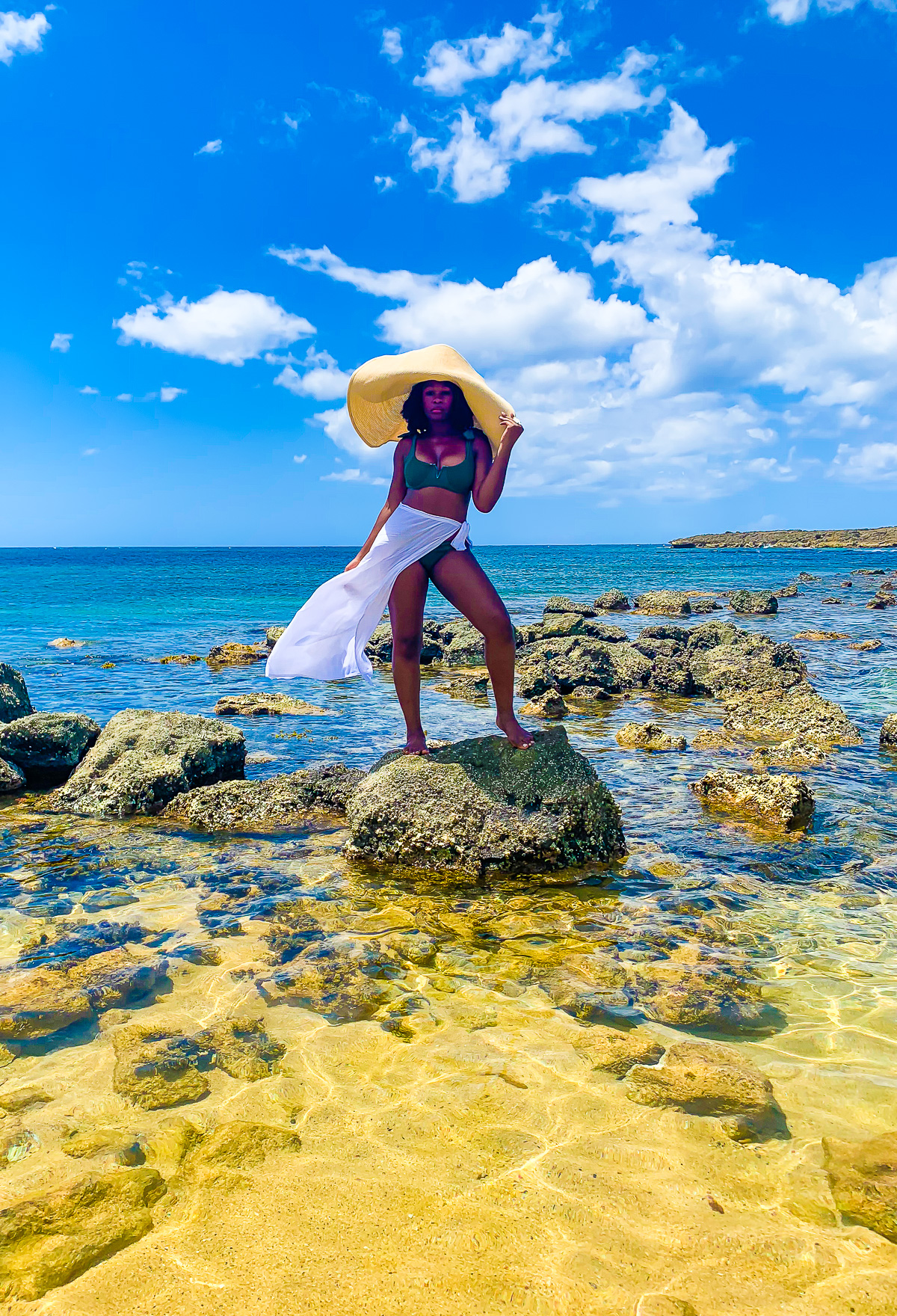 Jazzmine standing rock on Playa Escambron in Old San Juan, PR, United States.