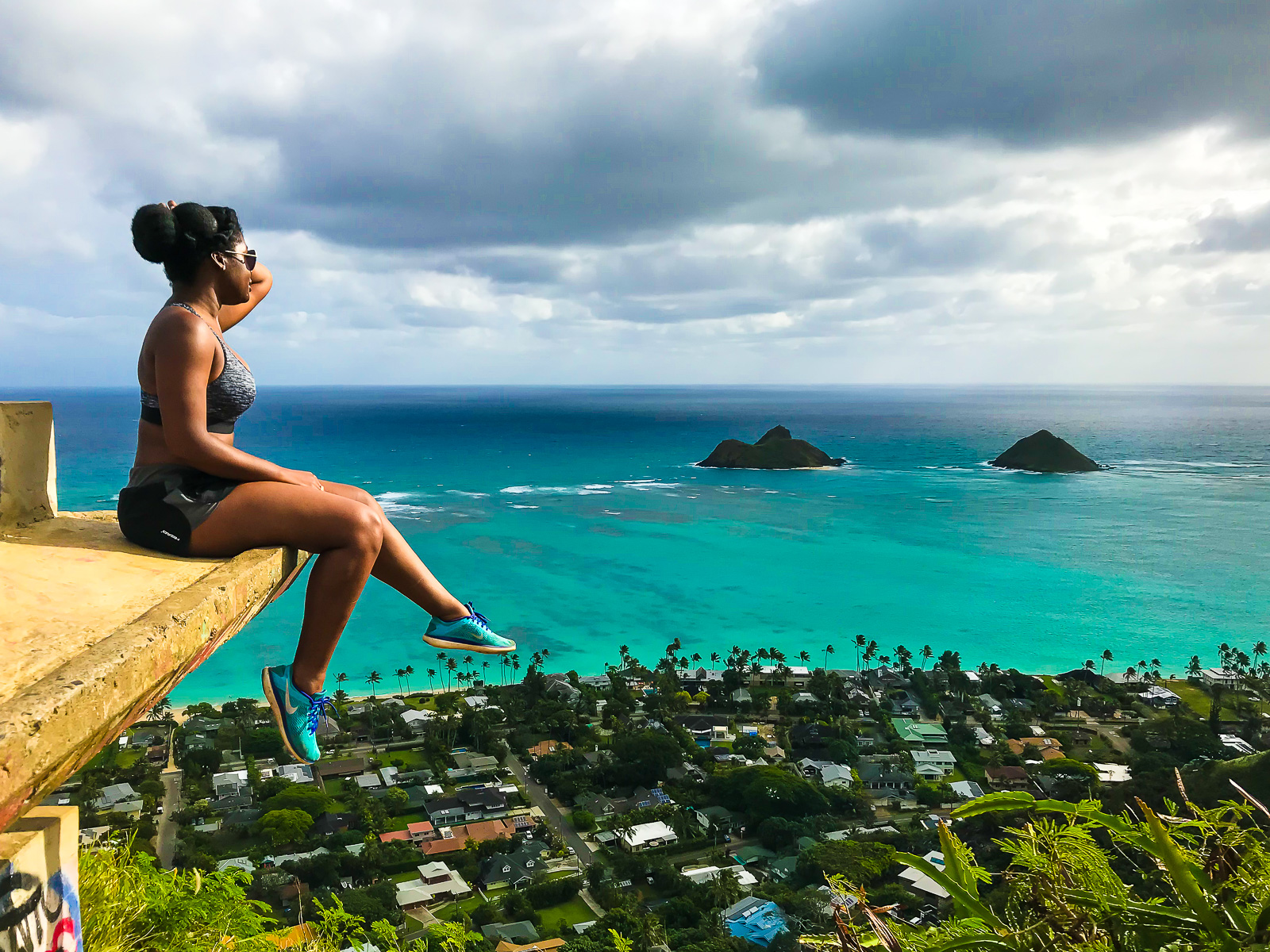 Jazzmine looking out at view of Lanikai Beach and the Mokula Islands from Lanikai Pillboxes hike.