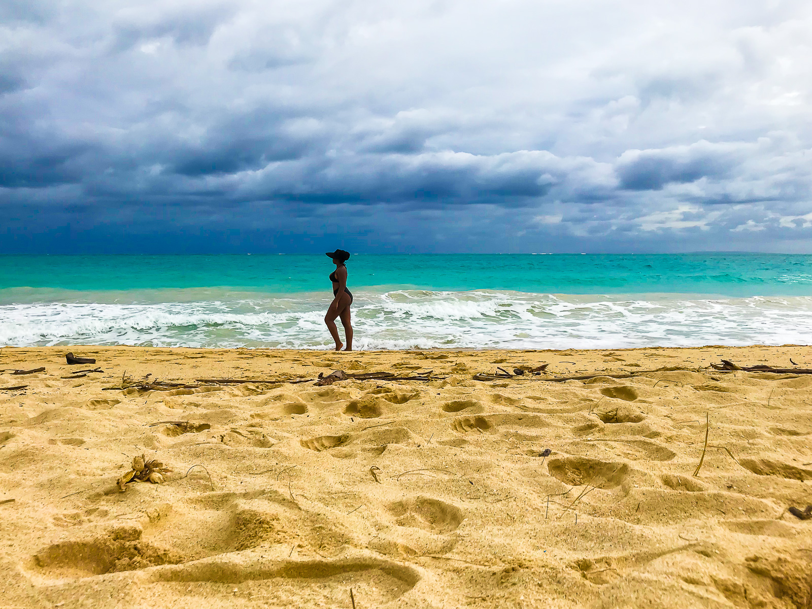 Jazzmine standing in water on Bellows Field Beach military beach, park, and campsite.