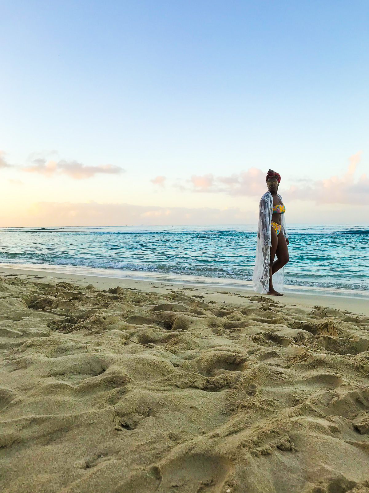 Jazzmine walking along shoreline at Ala Moana Beach in Oahu, Hawaii.