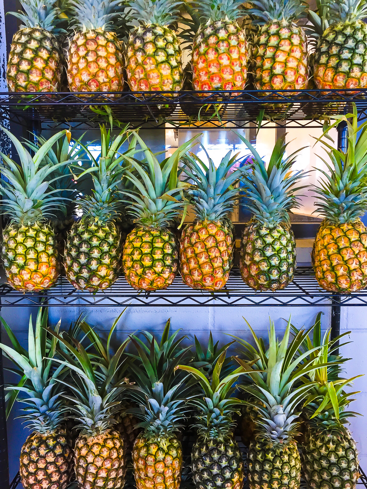display of fresh pineapples at Barefoot Beach Cafe on Waikiki Beach.