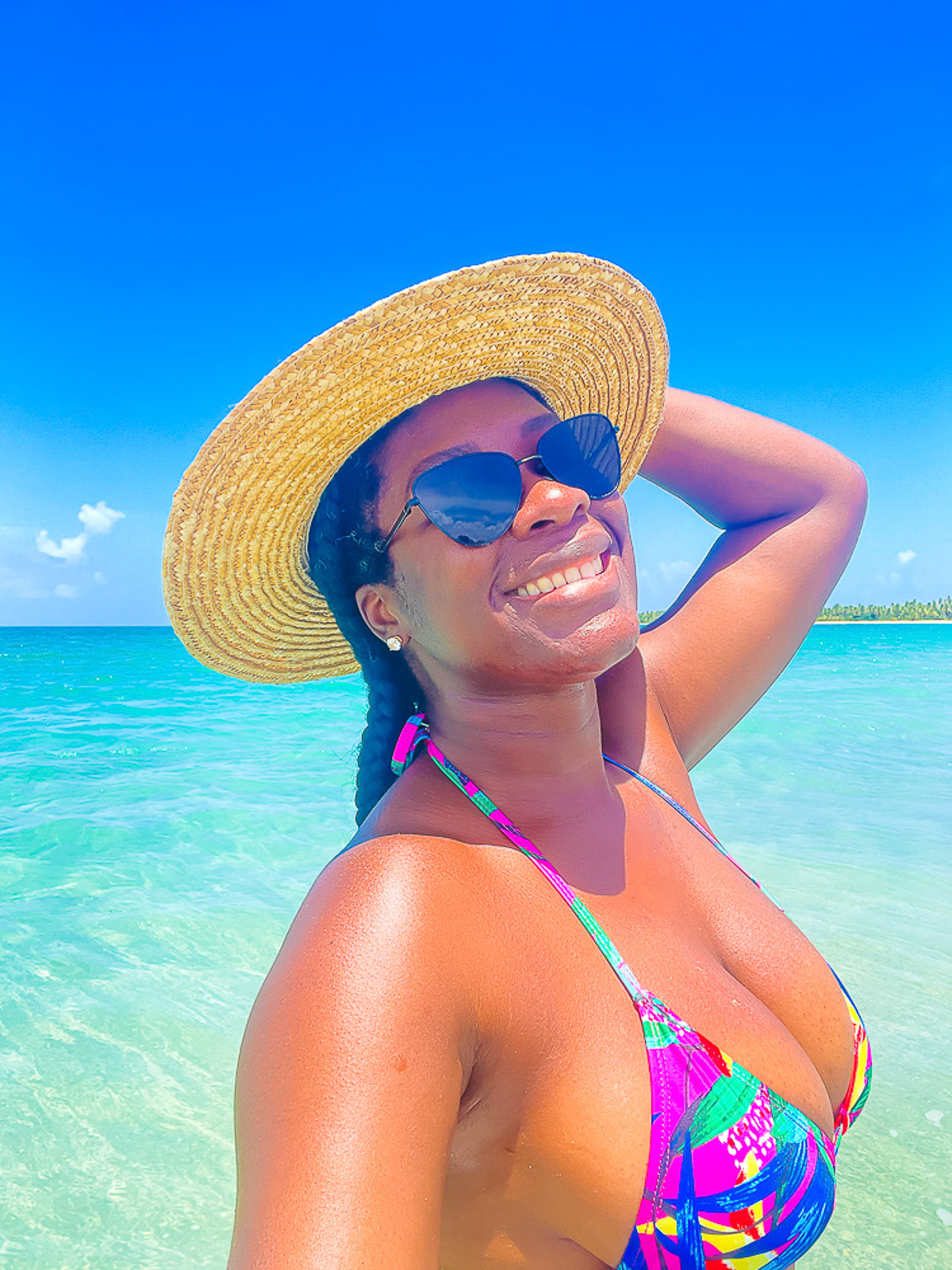 Jazzmine standing in crystal blue water at Playa Costa Esmeralda in Miches, Republica Dominicana.