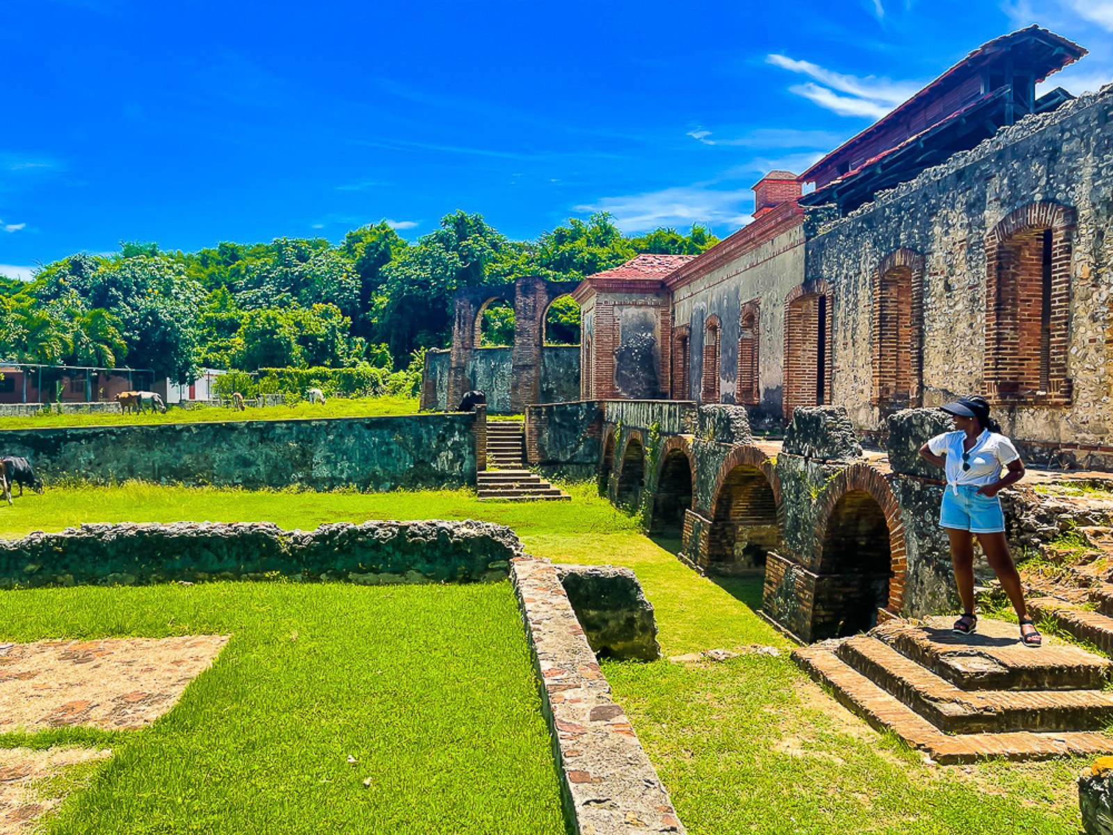Jazzmine walking around an abandoned sugar mill and distillery in Santo Domingo during a decolonial excursion.