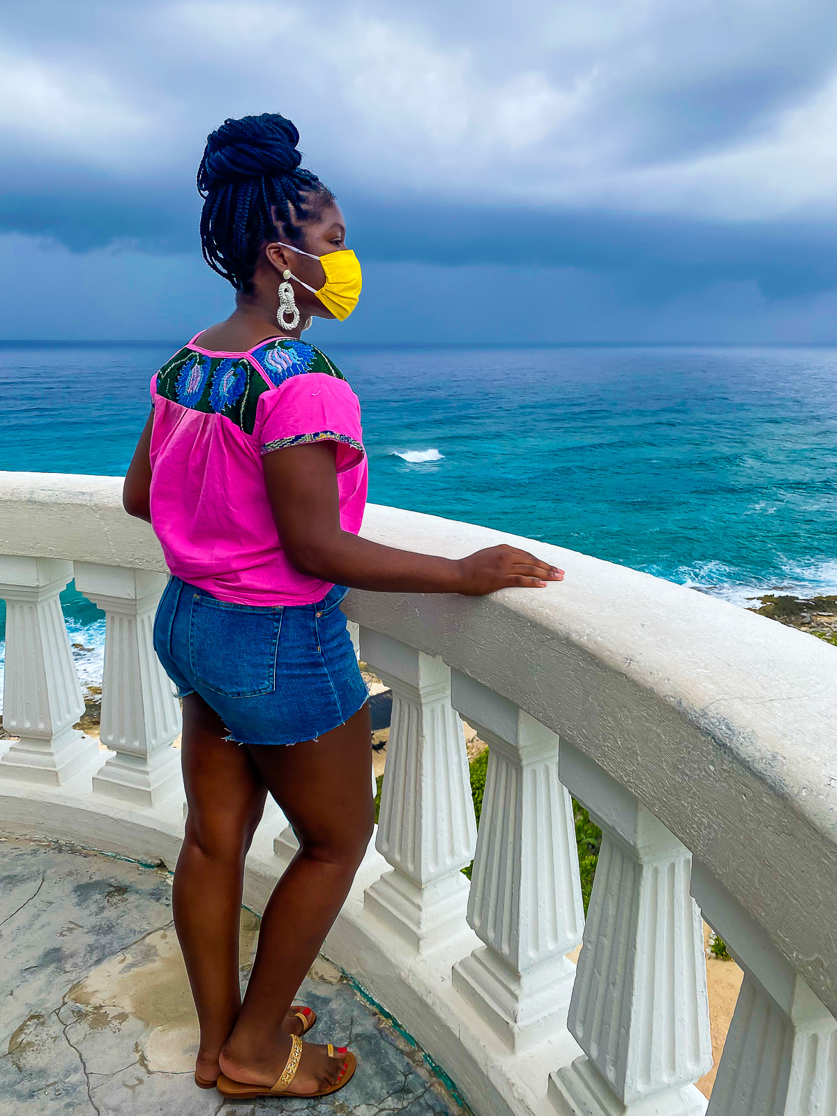 Jazzmine looking out at the ocean from top of Celarain Lighthouse in Cozumel, Q. Roo.