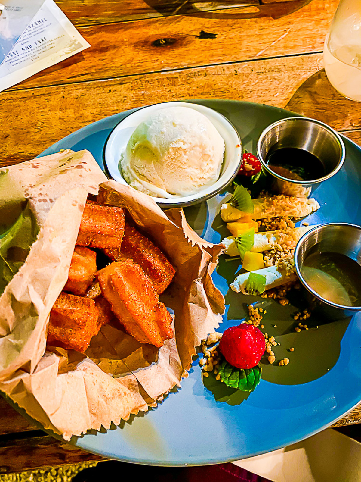 freshly fried churros with ice cream, sauces, and fruits for dessert at Kondesa Cozumel.