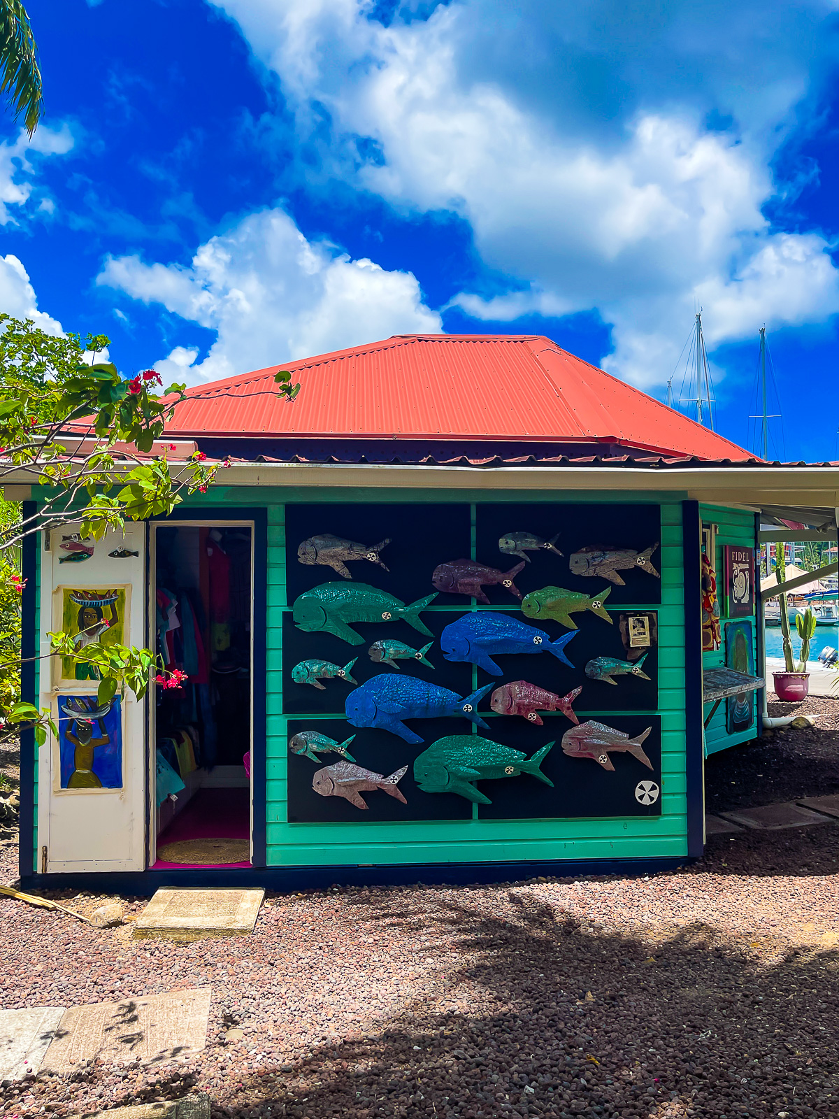 colorful artwork depicting a school of fish on the exterior of Fidel Grenada craft shop.