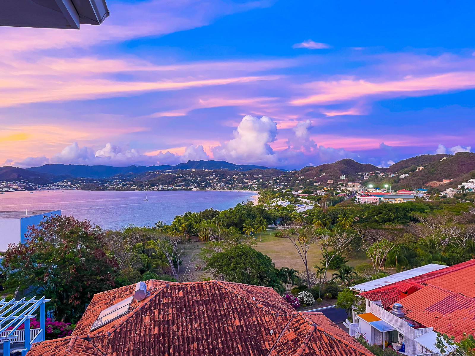 cotton candy colored sunset over Grand Anse Beach in Grenada, West Indies.