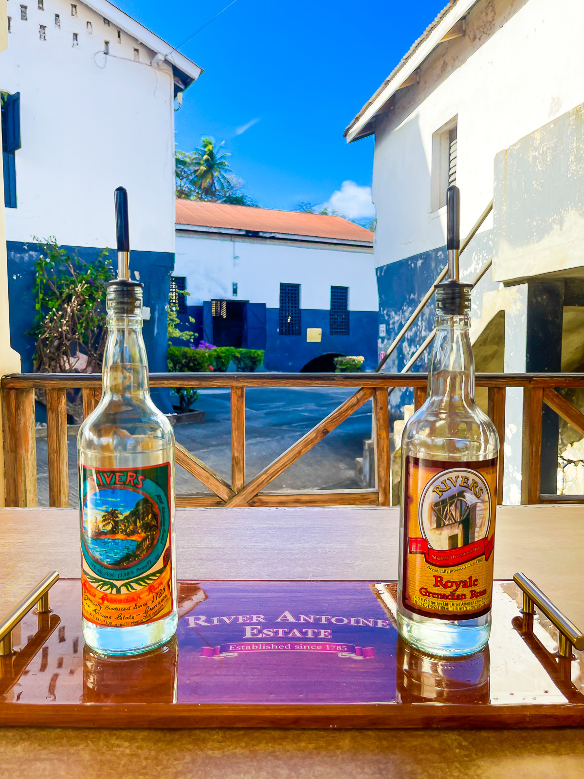 Bottles of authentic Grenadian rum for tasting at River Antoine Estate during a distillery tour.