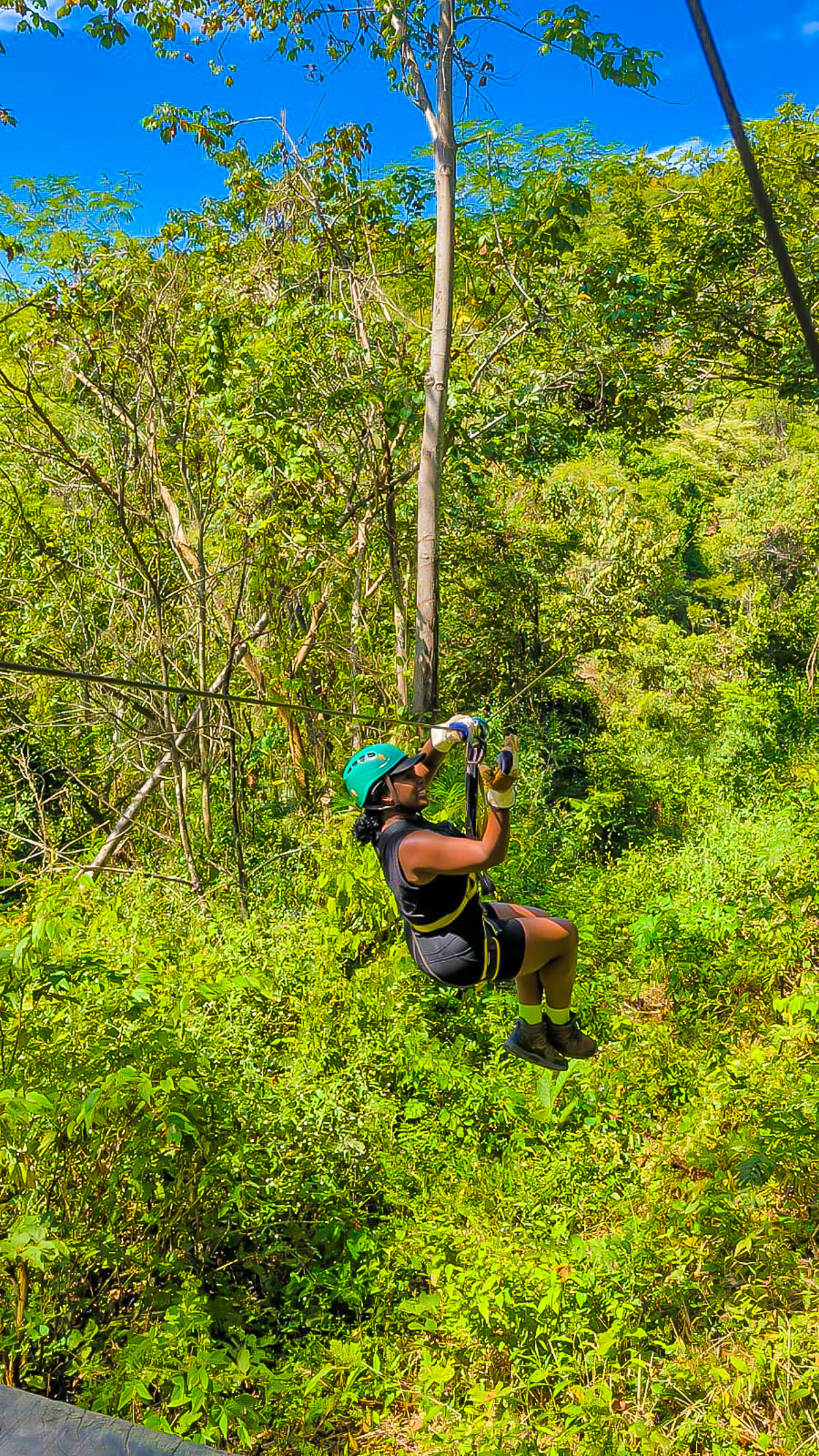 Jazzmine zip-lining through the jungle at Black Stallion Ranch in Guanacaste Province, Costa Rica.